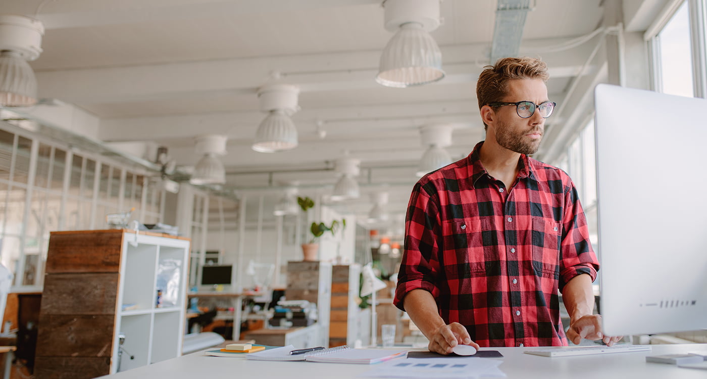 a woman and a man walking near water